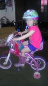 She is ready to ride, and of course she can't do it without her new pink sparkly cowgirl boots!